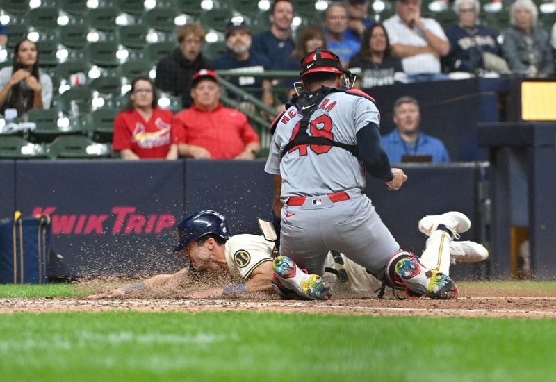 Sep 3, 2024; Milwaukee, Wisconsin, USA; Milwaukee Brewers outfielder Sal Frelick (10) is tagged out at home plate by St. Louis Cardinals catcher Pedro Pagés (43) in the tenth inning at American Family Field. Mandatory Credit: Michael McLoone-Imagn Images