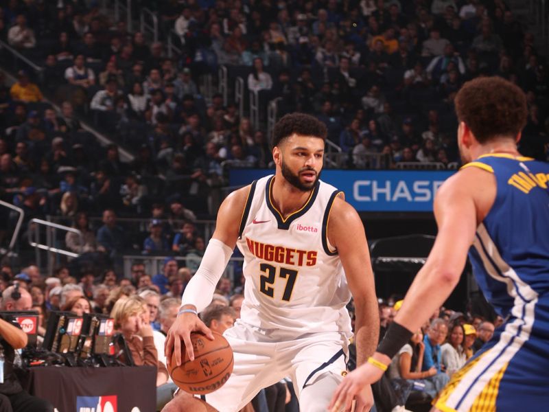 SAN FRANCISCO, CA - JANUARY 4: Jamal Murray #27 of the Denver Nuggets dribbles the ball during the game against the Golden State Warriors on January 4, 2024 at Chase Center in San Francisco, California. NOTE TO USER: User expressly acknowledges and agrees that, by downloading and or using this photograph, user is consenting to the terms and conditions of Getty Images License Agreement. Mandatory Copyright Notice: Copyright 2024 NBAE (Photo by Jed Jacobsohn/NBAE via Getty Images)