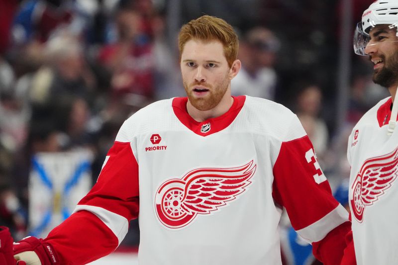 Mar 6, 2024; Denver, Colorado, USA; Detroit Red Wings left wing J.T. Compher (37) before the game against the Colorado Avalanche at Ball Arena. Mandatory Credit: Ron Chenoy-USA TODAY Sports