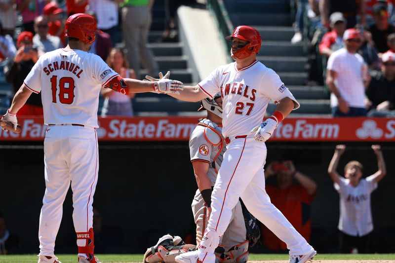 Apr 24, 2024; Anaheim, California, USA;  Los Angeles Angels designated hitter Mike Trout (27) is greeted by first base Nolan Schanuel (18) after hitting a home run during the sixth inning against the Baltimore Orioles at Angel Stadium. Mandatory Credit: Kiyoshi Mio-USA TODAY Sports