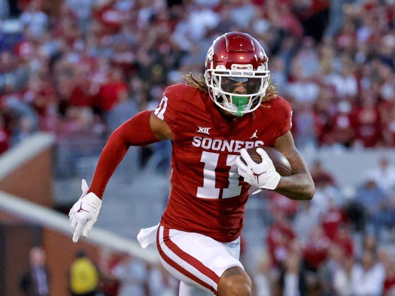 Oct 16, 2021; Norman, Oklahoma, USA; Oklahoma Sooners wide receiver Jadon Haselwood (11) runs with the ball during the game against the TCU Horned Frogs at Gaylord Family-Oklahoma Memorial Stadium. Mandatory Credit: Kevin Jairaj-USA TODAY Sports