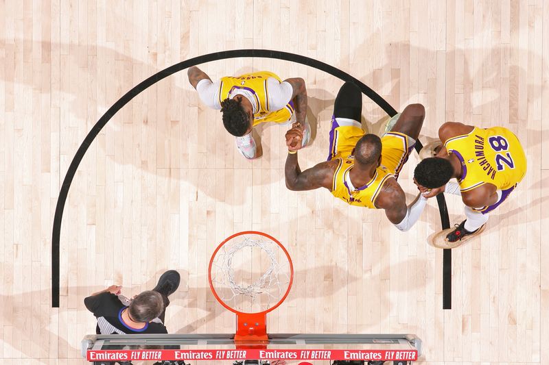 NEW ORLEANS, LA - APRIL 16: LeBron James #23 of the Los Angeles Lakers is helped up by teammates during the game against the New Orleans Pelicans during the 2024 SoFi Play-In Tournament on April 16, 2024 at the Smoothie King Center in New Orleans, Louisiana. NOTE TO USER: User expressly acknowledges and agrees that, by downloading and or using this Photograph, user is consenting to the terms and conditions of the Getty Images License Agreement. Mandatory Copyright Notice: Copyright 2024 NBAE (Photo by Layne Murdoch Jr./NBAE via Getty Images)