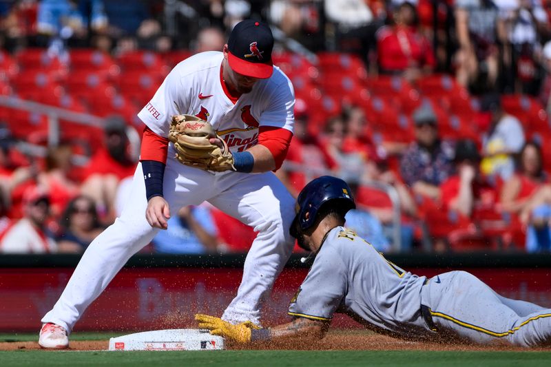 Sep 21, 2025; St. Louis, Missouri, USA; Milwaukee Brewers center fielder Blake Perkins (16) slides into the knee of St. Louis Cardinals third baseman Nolan Gorman (16) as he steals third base during the third inning at Busch Stadium. Mandatory Credit: Jeff Curry-Imagn Images