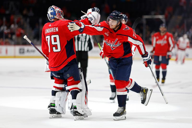 Sep 28, 2023; Washington, District of Columbia, USA; Washington Capitals goaltender Charlie Lindgren (79) celebrates with Capitals right wing T.J. Oshie (77) after their game against the Detroit Red Wings at Capital One Arena. Mandatory Credit: Geoff Burke-USA TODAY Sports