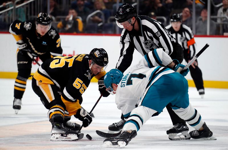 Mar 14, 2024; Pittsburgh, Pennsylvania, USA; Pittsburgh Penguins center Noel Acciari (55) and San Jose Sharks center Nico Sturm (7) take a face-off during the third period at PPG Paints Arena. Pittsburgh won 6-3. Mandatory Credit: Charles LeClaire-USA TODAY Sports