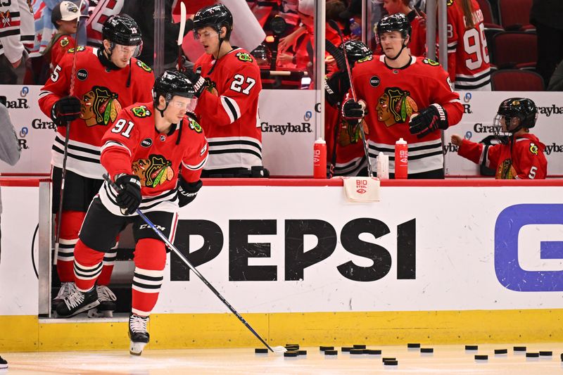 Dec 7, 2023; Chicago, Illinois, USA; Chicago Blackhawks forward Anthony Beauvillier (91) takes the ice with the rest of the team for warm ups before a game against the Anaheim Ducks at United Center. Mandatory Credit: Jamie Sabau-USA TODAY Sports