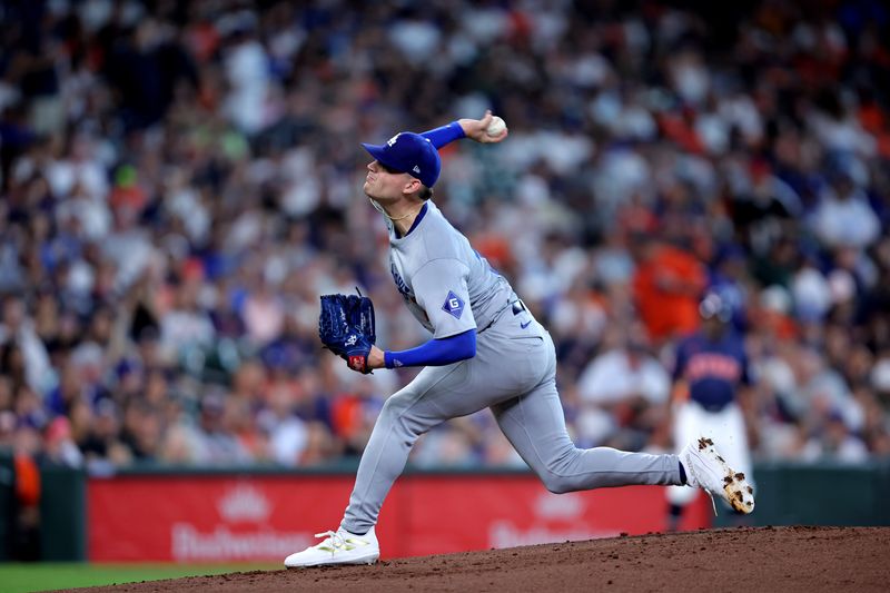 Jul 28, 2024; Houston, Texas, USA; Los Angeles Dodgers pitcher River Ryan (77) delivers a pitch against the Houston Astros during the first inning at Minute Maid Park. Mandatory Credit: Erik Williams-USA TODAY Sports