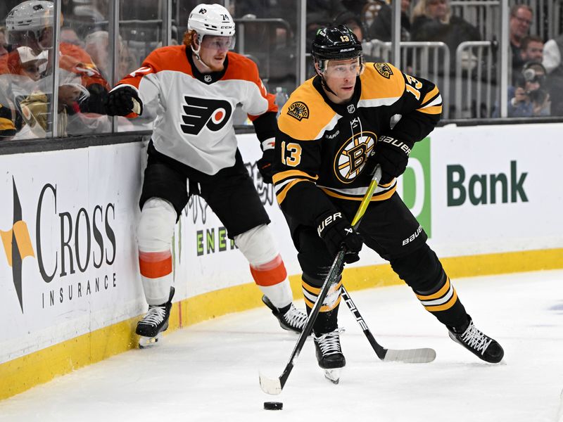 Oct 1, 2024; Boston, Massachusetts, USA; Boston Bruins center Charlie Coyle (13) controls the puck in front of Philadelphia Flyers right wing Owen Tippett (74) during the first period at the TD Garden. Mandatory Credit: Brian Fluharty-Imagn Images