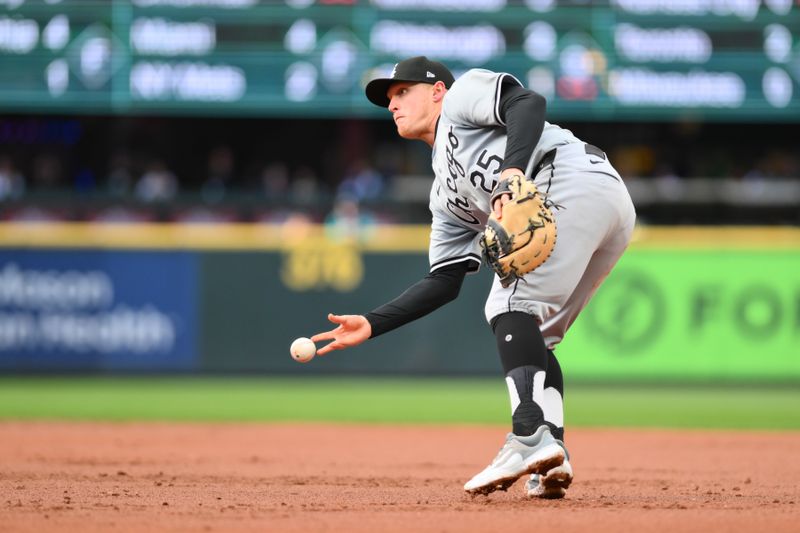 Jun 11, 2024; Seattle, Washington, USA; Chicago White Sox first baseman Andrew Vaughn (25) throws the ball to first base for a force out against the Seattle Mariners during the second inning at T-Mobile Park. Mandatory Credit: Steven Bisig-USA TODAY Sports