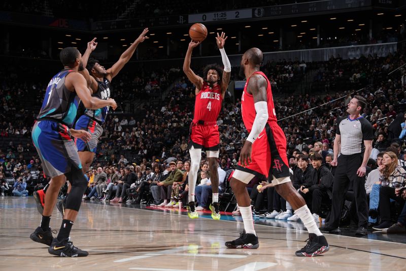 BROOKLYN, NY - JANUARY 27: Jalen Green #4 of the Houston Rockets shoots a three point basket against the Brooklyn Nets on January 27, 2024 at Barclays Center in Brooklyn, New York. NOTE TO USER: User expressly acknowledges and agrees that, by downloading and or using this Photograph, user is consenting to the terms and conditions of the Getty Images License Agreement. Mandatory Copyright Notice: Copyright 2024 NBAE (Photo by Jesse D. Garrabrant/NBAE via Getty Images)