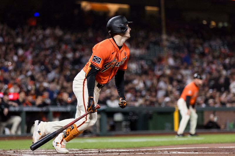 Aug 30, 2024; San Francisco, California, USA; San Francisco Giants right fielder Mike Yastrzemski (5) hits a single against the Miami Marlins during the third inning at Oracle Park. Mandatory Credit: John Hefti-USA TODAY Sports