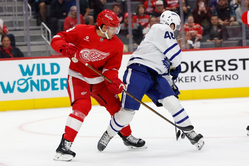 Oct 3, 2024; Detroit, Michigan, USA;  Detroit Red Wings defenseman Ben Chiarot (8) skates against the Toronto Maple Leafs in the first period at Little Caesars Arena. Mandatory Credit: Rick Osentoski-Imagn Images