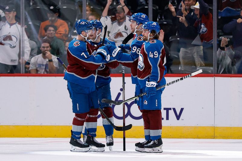 Oct 5, 2022; Denver, Colorado, USA; Colorado Avalanche right wing Mikko Rantanen (96) celebrates his goal with defenseman Samuel Girard (49) and defenseman Devon Toews (7) and left wing Artturi Lehkonen (62) in the third period against the Dallas Stars at Ball Arena. Mandatory Credit: Isaiah J. Downing-USA TODAY Sports