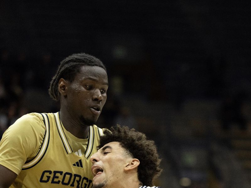 Feb 4, 2026; Berkeley, California, USA; California Golden Bears guard Justin Pippen (10) drives against Georgia Tech Yellow Jackets forward Baye Ndongo (11) during the second half at Haas Pavilion. Mandatory Credit: D. Ross Cameron-Imagn Images