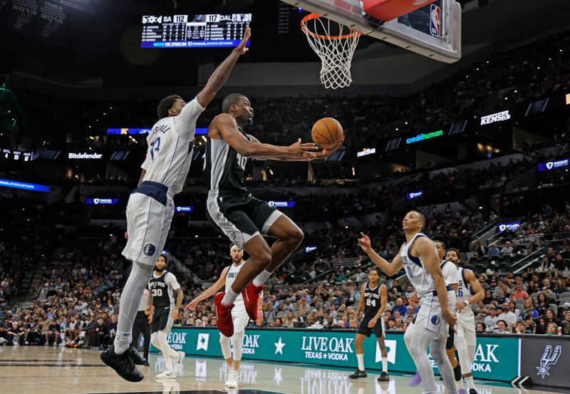 SAN ANTONIO, TX - MARCH 10:  Harrison Barnes #40 of the San Antonio Spurs drives past Naji Marshall #13 of the Dallas Mavericks in the second half at Frost Bank Center on March 10, 2025 in San Antonio, Texas. NOTE TO USER: User expressly acknowledges and agrees that, by downloading and or using this photograph, User is consenting to terms and conditions of the Getty Images License Agreement. (Photo by Ronald Cortes/Getty Images)