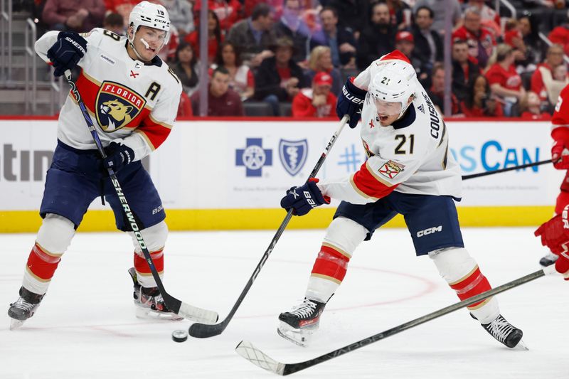 Mar 2, 2024; Detroit, Michigan, USA; Detroit Red Wings center Austin Czarnik (21) takes a shot in the third period against the Detroit Red Wings at Little Caesars Arena. Mandatory Credit: Rick Osentoski-USA TODAY Sports