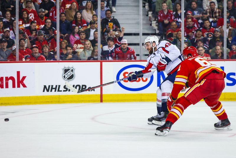 Mar 18, 2024; Calgary, Alberta, CAN; Washington Capitals right wing Tom Wilson (43) scores a goal against the Calgary Flames during the third period at Scotiabank Saddledome. Mandatory Credit: Sergei Belski-USA TODAY Sports