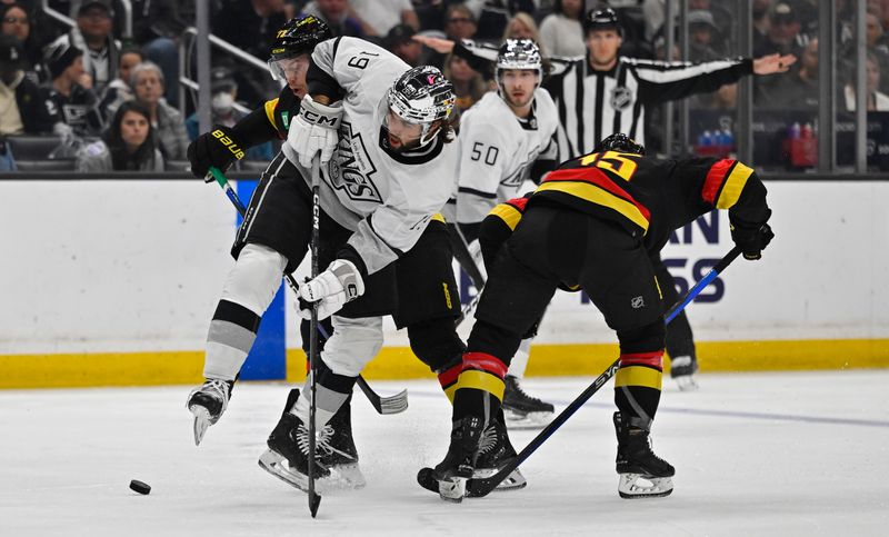 Apr 10, 2023; Los Angeles, California, USA;  Los Angeles Kings left wing Alex Iafallo (19) takes a shot on goal in the second period against the Vancouver Canucks at Crypto.com Arena. Mandatory Credit: Jayne Kamin-Oncea-USA TODAY Sports