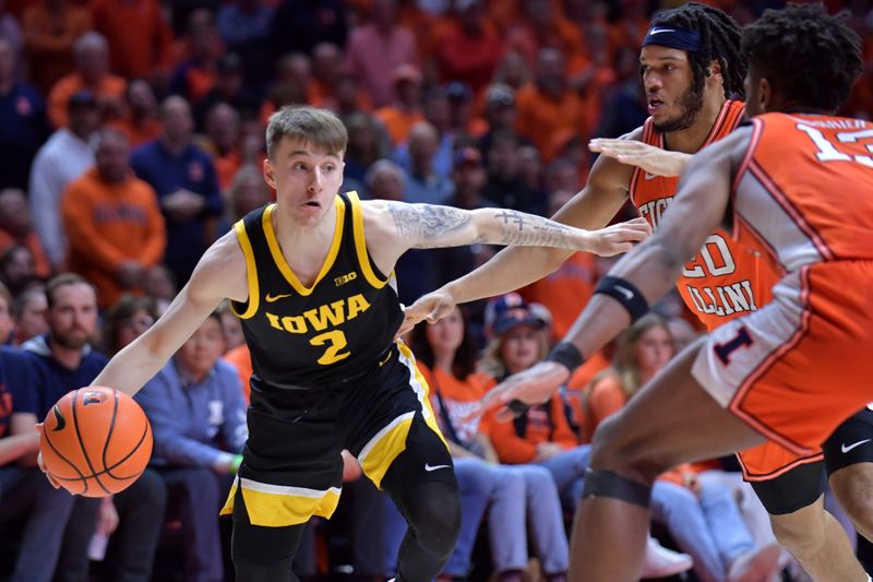 Feb 24, 2024; Champaign, Illinois, USA;  Iowa Hawkeyes guard Brock Harding (2) drives the ball against Illinois Fighting Illini forward Ty Rodgers (20) and forward Quincy Guerrier (13)during the second half at State Farm Center. Mandatory Credit: Ron Johnson-USA TODAY Sports