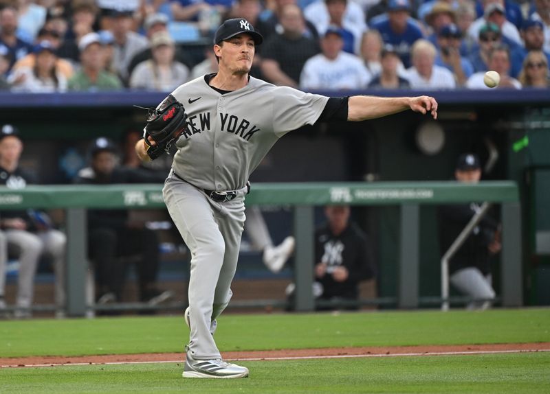 Jun 10, 2025; Kansas City, Missouri, USA;  New York Yankees starting pitcher Max Fried (54) throws the ball to first base for an out in the second inning against the Kansas City Royals at Kauffman Stadium. Mandatory Credit: Peter Aiken-Imagn Images
