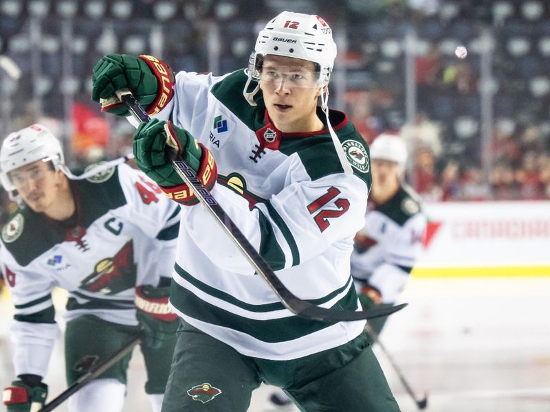 Nov 23, 2024; Calgary, Alberta, CAN; Minnesota Wild left wing Matthew Boldy (12) warms up before a game against the Calgary Flames at Scotiabank Saddledome. Mandatory Credit: Brett Holmes-Imagn Images