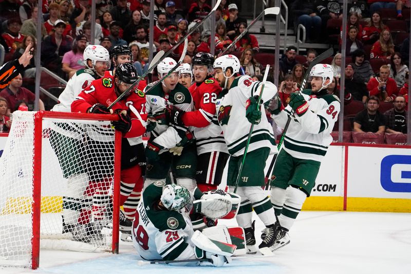 Oct 4, 2024; Chicago, Illinois, USA; Minnesota Wild goaltender Marc-Andre Fleury (29) makes a save against the Chicago Blackhawks during the third period at United Center. Mandatory Credit: David Banks-Imagn Images