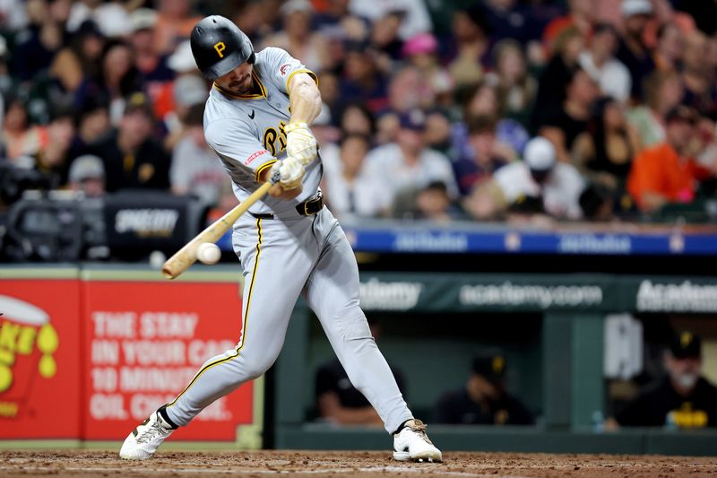 Jul 31, 2024; Houston, Texas, USA; Pittsburgh Pirates left fielder Bryan Reynolds (10) hits an infield single against the Houston Astros during the fifth inning at Minute Maid Park. Mandatory Credit: Erik Williams-USA TODAY Sports