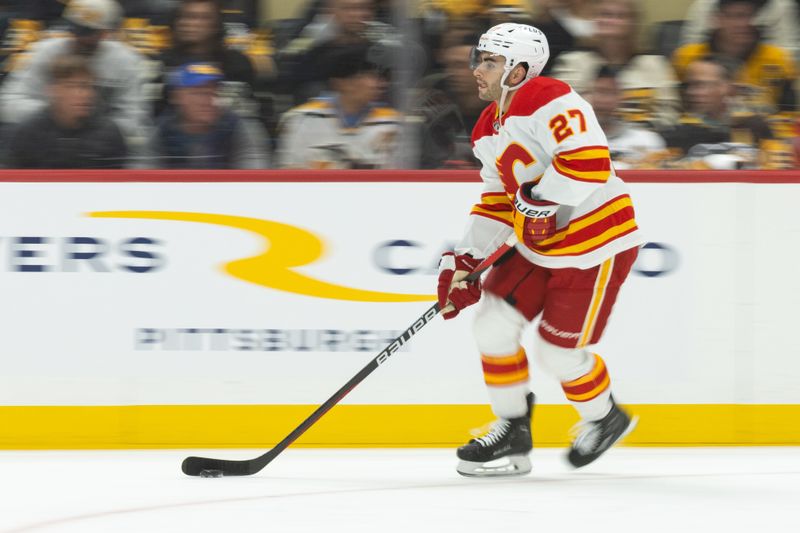 Oct 14, 2023; Pittsburgh, Pennsylvania, USA; Calgary Flames right winger Matt Coronato (27) skates the puck around during warm up before the game against the Pittsburgh Penguins at PPG Paints Arena. Mandatory Credit: Scott Galvin-USA TODAY Sports