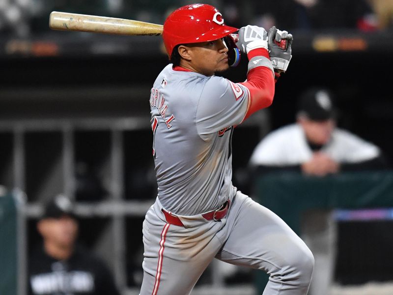 Apr 12, 2024; Chicago, Illinois, USA; Cincinnati Reds third base Santiago Espinal (4) hits a two-run single during the ninth inning against the Chicago White Sox at Guaranteed Rate Field. Mandatory Credit: Patrick Gorski-USA TODAY Sports