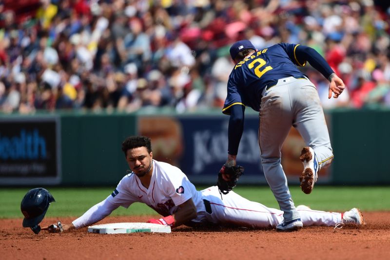 May 26, 2024; Boston, Massachusetts, USA;  Boston Red Sox shortstop David Hamilton (70) safely steals second base past the tag of Milwaukee Brewers second baseman Brice Turang (2) during the third inning at Fenway Park. Mandatory Credit: Bob DeChiara-USA TODAY Sports