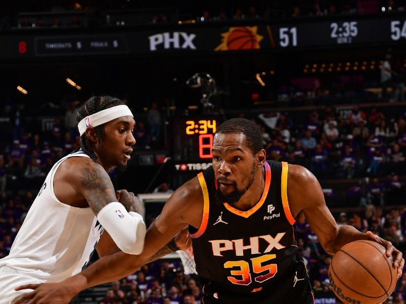 PHOENIX, AZ - APRIL  26: Kevin Durant #35 of the Phoenix Suns handles the ball during the game against the Minnesota Timberwolves on April 26, 2024 at Footprint Center in Phoenix, Arizona. NOTE TO USER: User expressly acknowledges and agrees that, by downloading and or using this photograph, user is consenting to the terms and conditions of the Getty Images License Agreement. Mandatory Copyright Notice: Copyright 2024 NBAE (Photo by Kate Frese/NBAE via Getty Images)