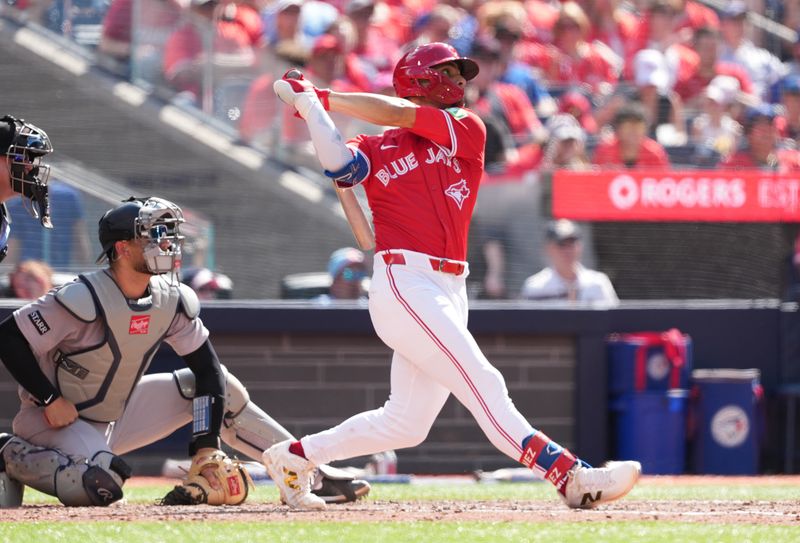 Jul 1, 2025; Toronto, Ontario, CAN; Toronto Blue Jays second baseman Andre Gimenez (0) hits a three run home run against the New York Yankees during the fourth inning at Rogers Centre. Mandatory Credit: Nick Turchiaro-Imagn Images