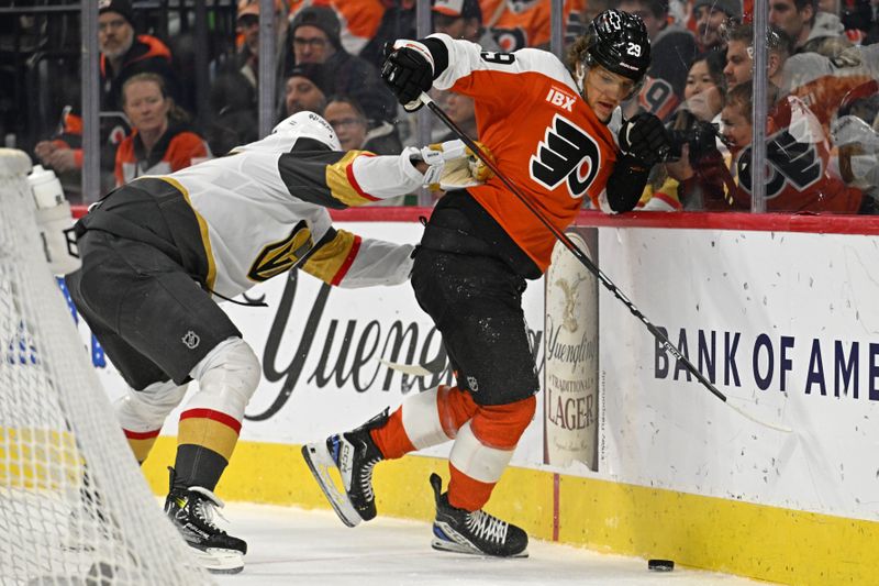 Dec 11, 2025; Philadelphia, Pennsylvania, USA; Philadelphia Flyers right wing Nikita Grebenkin (29) is checked by Vegas Golden Knights defenseman Ben Hutton (17) during the first period at Xfinity Mobile Arena. Mandatory Credit: Eric Hartline-Imagn Images