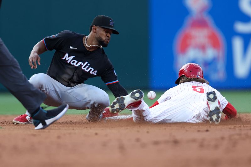 Aug 14, 2024; Philadelphia, Pennsylvania, USA; Philadelphia Phillies second base Bryson Stott (5) steals second base past Miami Marlins second base Otto Lopez (61) during the second inning at Citizens Bank Park. Mandatory Credit: Bill Streicher-USA TODAY Sports