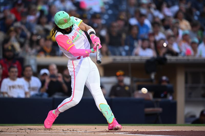 Jun 23, 2023; San Diego, California, USA; San Diego Padres right fielder Fernando Tatis Jr. (23) hits a single against the Washington Nationals during the first inning at Petco Park. Mandatory Credit: Orlando Ramirez-USA TODAY Sports