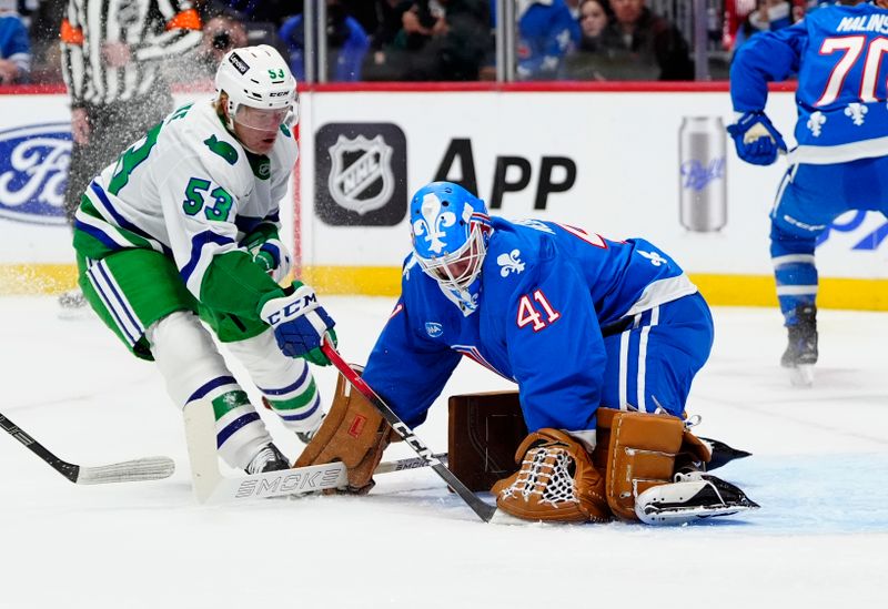 Oct 23, 2025; Denver, Colorado, USA; Carolina Hurricanes right wing Jackson Blake (53) shoots the puck at Colorado Avalanche goaltender Scott Wedgewood (41) in the first period at Ball Arena. Mandatory Credit: Ron Chenoy-Imagn Images