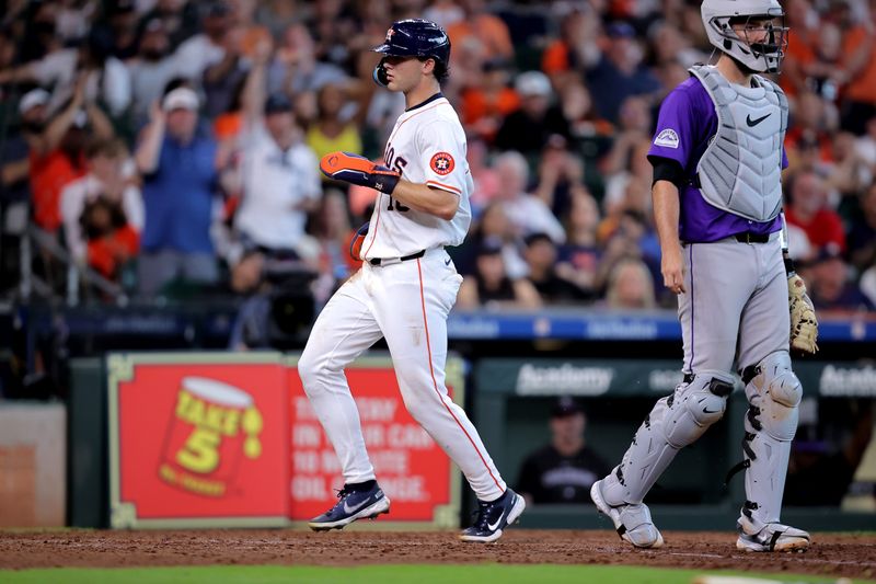 Jun 26, 2024; Houston, Texas, USA; Houston Astros right fielder Joey Loperfido (10) crosses home plate to score a run against the Colorado Rockies during the seventh inning at Minute Maid Park. Mandatory Credit: Erik Williams-USA TODAY Sports
