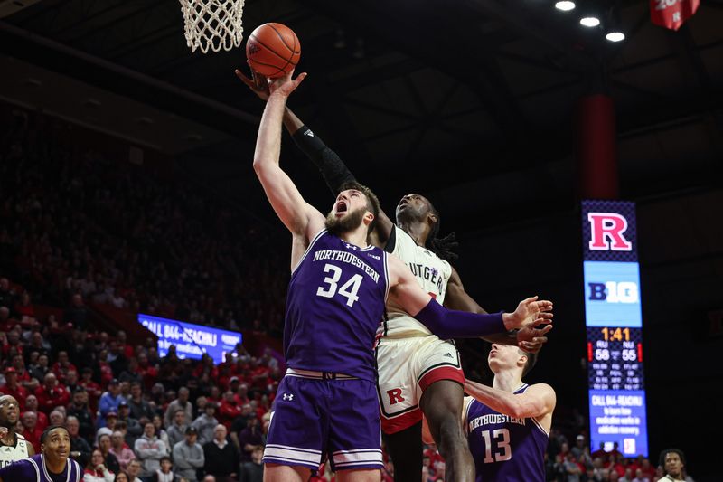 Feb 15, 2024; Piscataway, New Jersey, USA; Northwestern Wildcats center Matthew Nicholson (34) rebounds against Rutgers Scarlet Knights center Clifford Omoruyi (11) in front of guard Brooks Barnhizer (13) during the second half at Jersey Mike's Arena. Mandatory Credit: Vincent Carchietta-USA TODAY Sports