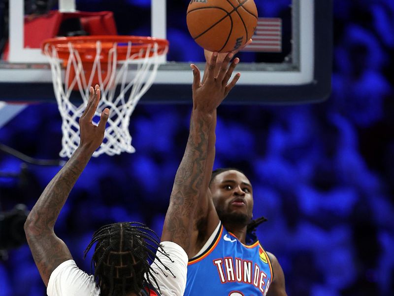 OKLAHOMA CITY, OKLAHOMA - APRIL 24:  Cason Wallace #22 of the Oklahoma City Thunder blocks a shot by Naji Marshall #8 of the New Orleans Pelicans during game two of the first round of the NBA playoffs at Paycom Center on April 24, 2024 in Oklahoma City, Oklahoma. (Photo by Jamie Squire/Getty Images)