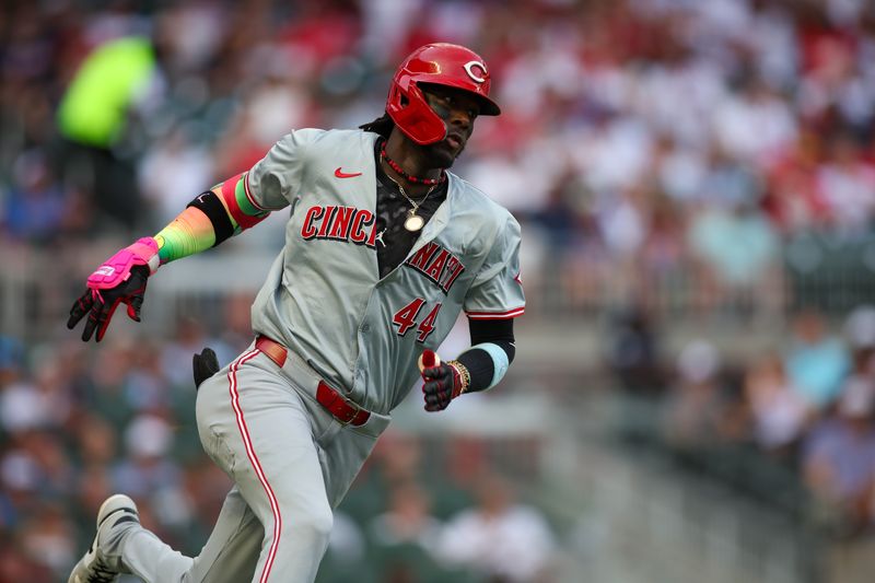 Jul 22, 2024; Atlanta, Georgia, USA; Cincinnati Reds shortstop Elly De La Cruz (44) hits a triple against the Atlanta Braves in the first inning at Truist Park. Mandatory Credit: Brett Davis-USA TODAY Sports