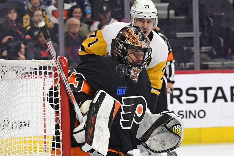 Feb 25, 2025; Philadelphia, Pennsylvania, USA; Philadelphia Flyers goaltender Samuel Ersson (33) makes a save against the Pittsburgh Penguins during the third period at Wells Fargo Center. Mandatory Credit: Eric Hartline-Imagn Images