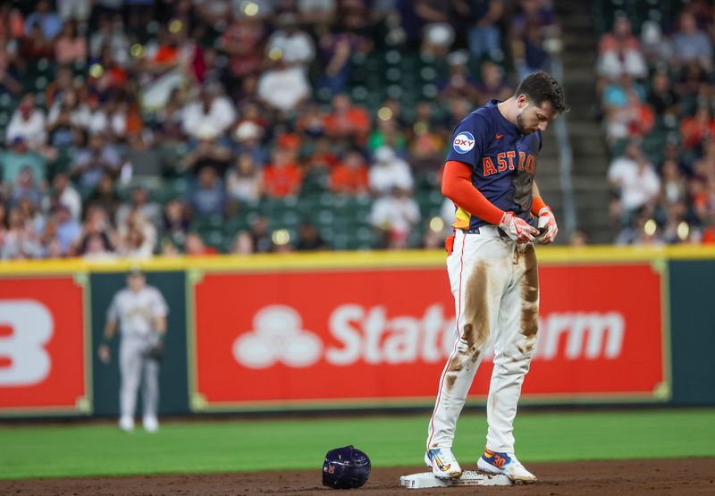 May 15, 2024; Houston, Texas, USA; Houston Astros right fielder Kyle Tucker (30) wipes off his uniform after hitting a double against the Oakland Athletics in the first inning at Minute Maid Park. Mandatory Credit: Thomas Shea-USA TODAY Sports