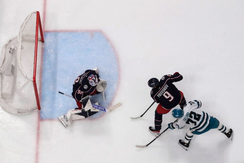 Mar 28, 2026; Columbus, Ohio, USA; Columbus Blue Jackets goalie Elvis Merzlikins (90) makes a save on the shot from San Jose Sharks left wing William Eklund (72) during the second period at Nationwide Arena. Mandatory Credit: Russell LaBounty-Imagn Images