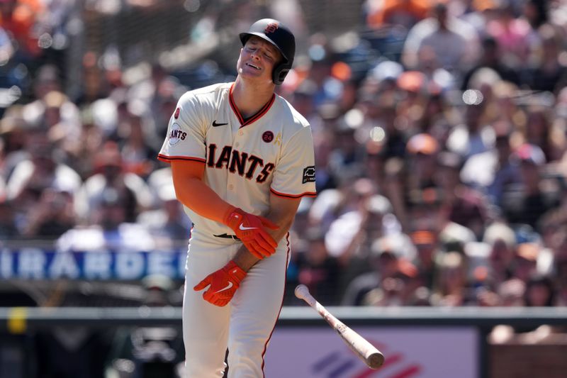 Sep 1, 2024; San Francisco, California, USA; San Francisco Giants third baseman Matt Chapman (26) reacts after being hit by a pitch during the first inning against the Miami Marlins at Oracle Park. Mandatory Credit: Darren Yamashita-USA TODAY Sports