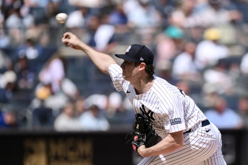 Aug 22, 2024; Bronx, New York, USA; New York Yankees pitcher Gerrit Cole (45) pitches against the Cleveland Guardians during the second inning at Yankee Stadium. Mandatory Credit: John Jones-USA TODAY Sports