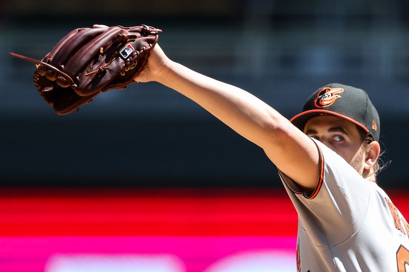 May 8, 2025; Minneapolis, Minnesota, USA; Baltimore Orioles starting pitcher Dean Kremer (64) delivers a pitch against the Minnesota Twins during the fifth inning at Target Field. Mandatory Credit: Matt Krohn-Imagn Images