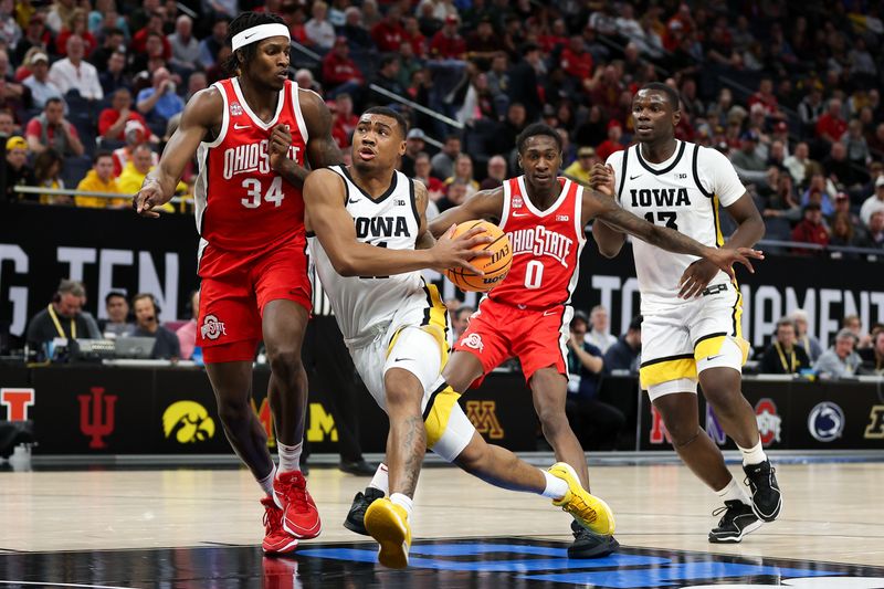 Mar 14, 2024; Minneapolis, MN, USA; Iowa Hawkeyes guard Tony Perkins (11) drives towards the basket as Ohio State Buckeyes center Felix Okpara (34) defends during the first half at Target Center. Mandatory Credit: Matt Krohn-USA TODAY Sports