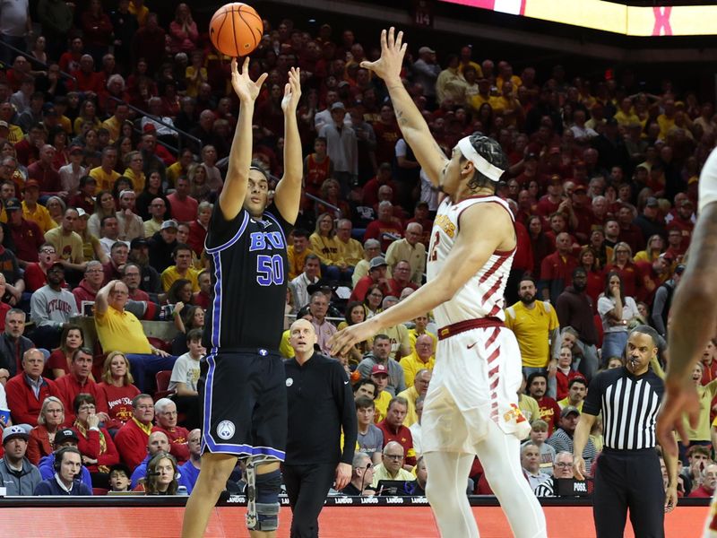 Mar 6, 2024; Ames, Iowa, USA; Brigham Young Cougars center Aly Khalifa (50) shoots over Iowa State Cyclones forward Robert Jones (12) in the second half at James H. Hilton Coliseum. Mandatory Credit: Reese Strickland-USA TODAY Sports

