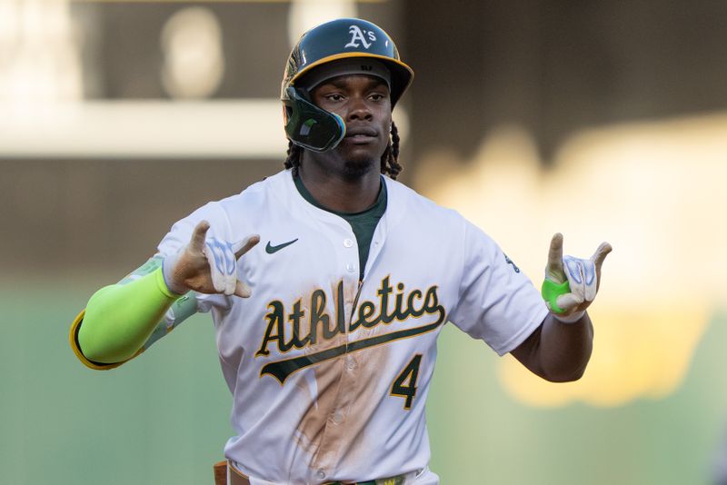 Jul 23, 2024; Oakland, California, USA;  Oakland Athletics outfielder Lawrence Butler (4) celebrates after hitting a solo home run during the third inning against the Houston Astros at Oakland-Alameda County Coliseum. Mandatory Credit: Stan Szeto-USA TODAY Sports