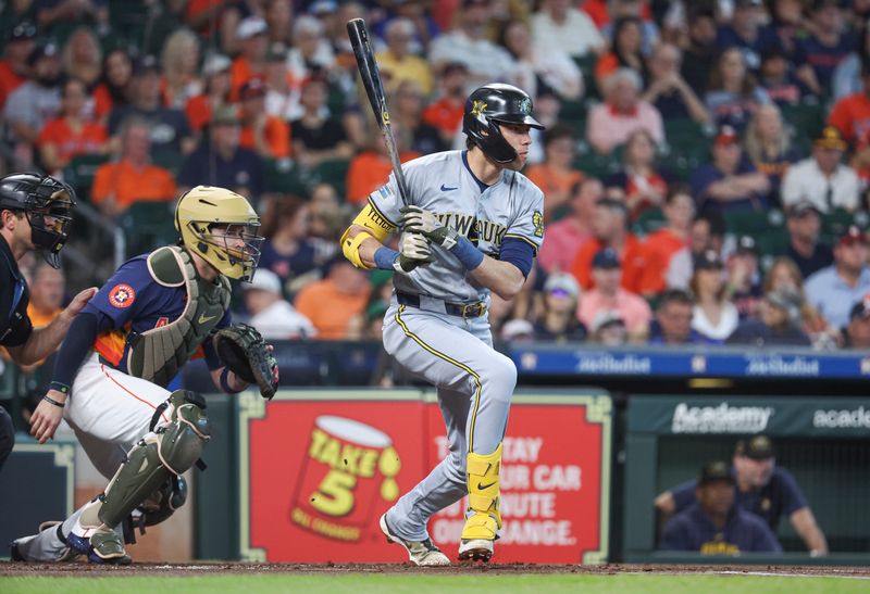 May 19, 2024; Houston, Texas, USA; Milwaukee Brewers designated hitter Christian Yelich (22) hits an RBI sinlge during the first inning against the Houston Astros at Minute Maid Park. Mandatory Credit: Troy Taormina-USA TODAY Sports